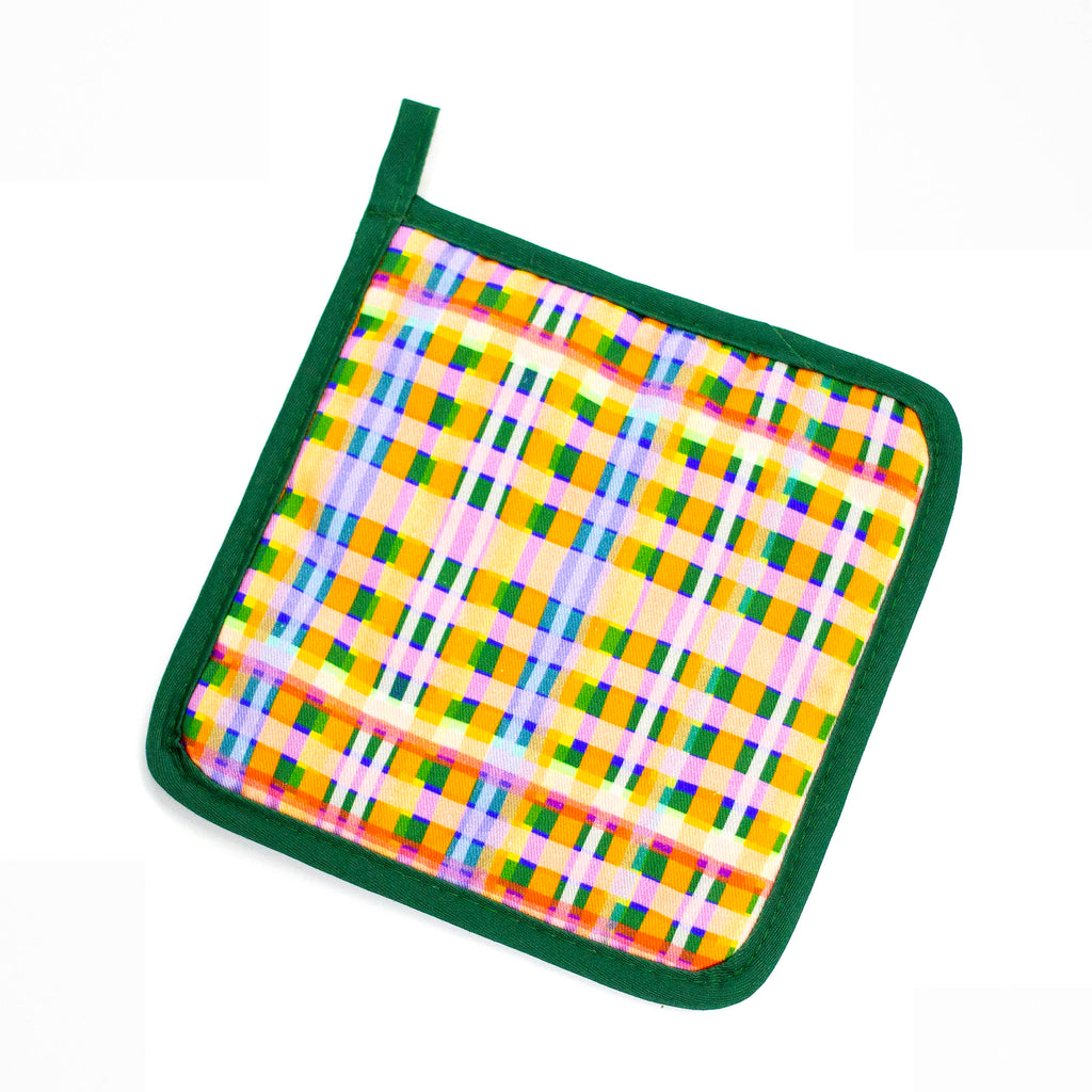 Top view of the Tartan Pot holder. Pink, green, orange, white, purple, blue layers in a tartan design. 