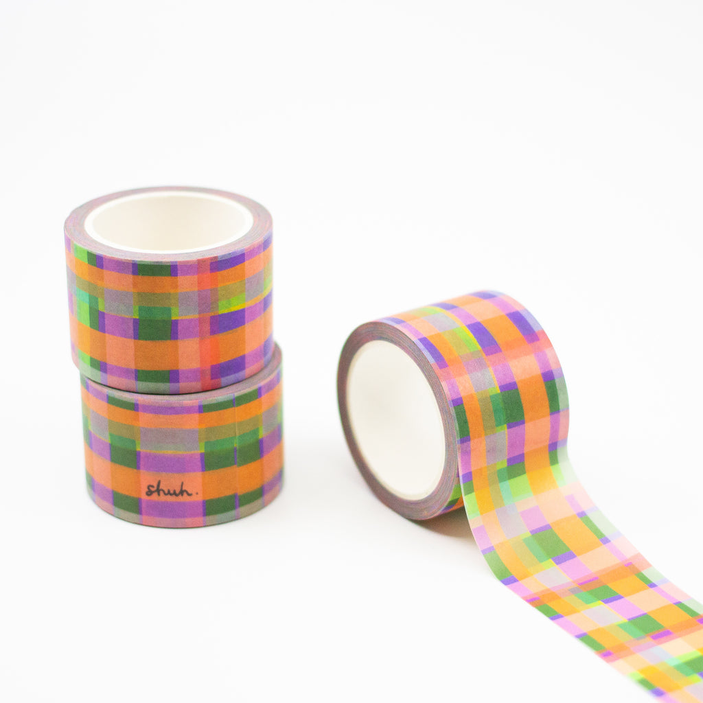 3 rolls of the Tartan print washi tape. A multicoloured plaid pattern, with purple, green, orange, yellow, and blue. 