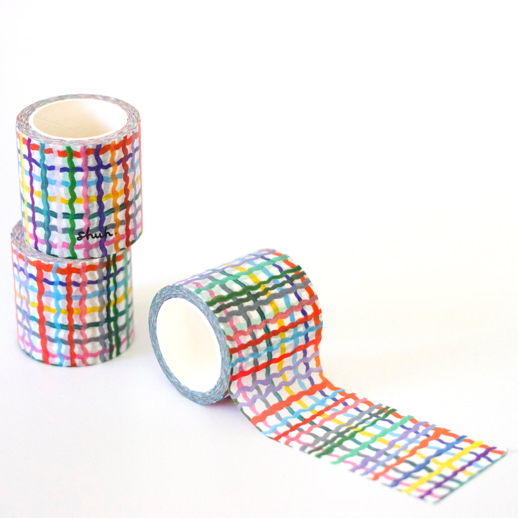 3 rolls of the Wave washi tape. A plaid pattern with multicoloured wavy lines. 